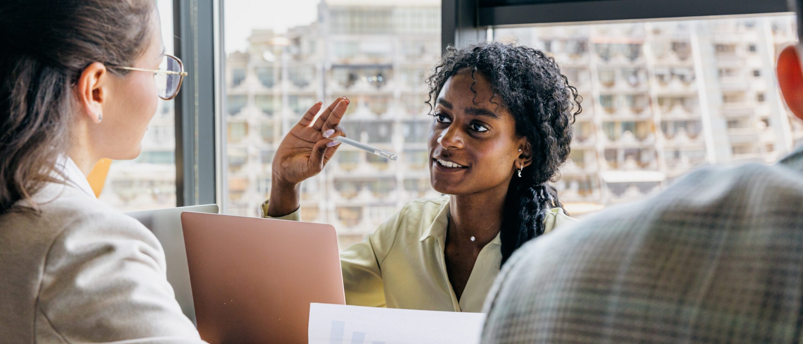Two professionals in a meeting discussing flexible HR support